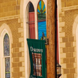 Power pole, banner and stained glass