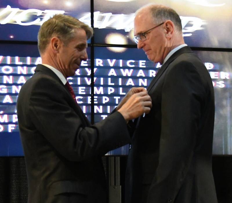 DAHLGREN, Va. (May 10, 2019) – U.S. Rep. Rob Wittman pins the Department of the Navy Superior Civilian Service Medal on Gilbert Goddin at the Naval Surface Warfare Center Dahlgren Division (NSWCDD) annual honor awards ceremony. Goddin was recognized for his remarkable management abilities, innovative thinking, and outstanding leadership serving as the chief systems engineer for the Electromagnetic Railgun and the Hypervelocity Gun Weapon System development and integration efforts from May 2015 to November 2017.  (U.S. Navy photo/Released)