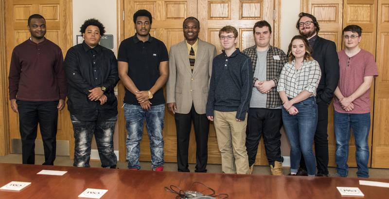 Having won accolades and prize money, nine CSM students will now have their award-winning public service announcements about vehicle theft prevention air throughout the year across the state of Maryland. The winners pictured with their professor from left are Tionte Smiley, Joseph Neal III, Kevin Poole, CSM Associate Professor and Program Coordinator Olaniyi Areke, Stephen Gardner, Jacob Buchanan, Jillian Roberts, Christian Pomponio and Dylan Fox. Not pictured is winner Michael Baranowski.