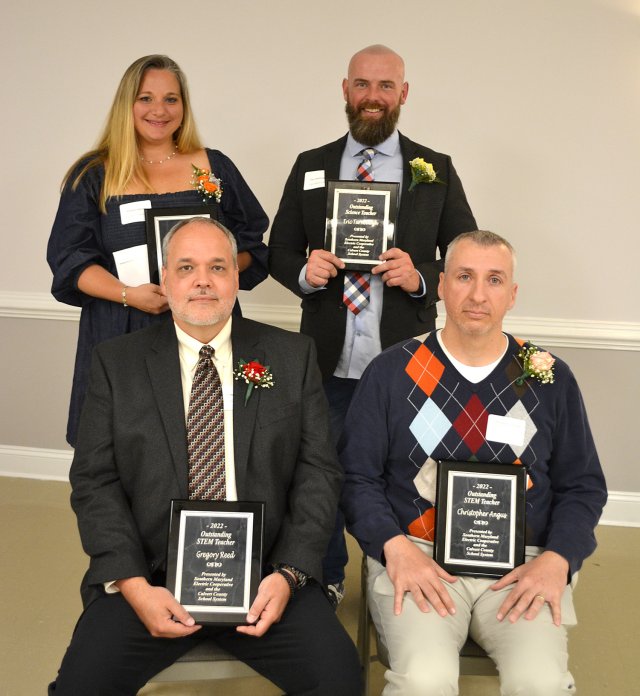 SMECO Outstanding Science and STEM Teacher Award Recipients, Calvert County  Standing are, from left, Meghan Johnson, Huntingtown High School, and Eric Turnbaugh, Calvert Middle School. Seated, from left, are Gregory Reed, Mill Creek Middle School, and Christopher Angus, Windy Hill Elementary School.