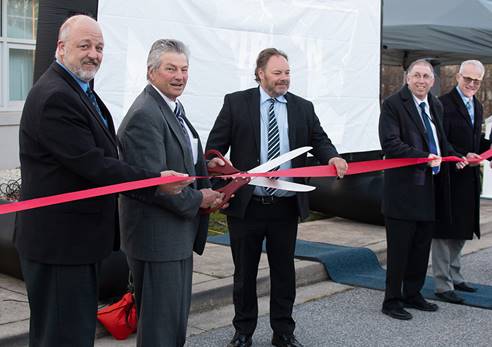 The Calvert County Board of County Commissioners cut a ribbon to celebrate the opening of the new Calvert Broadcast studio.