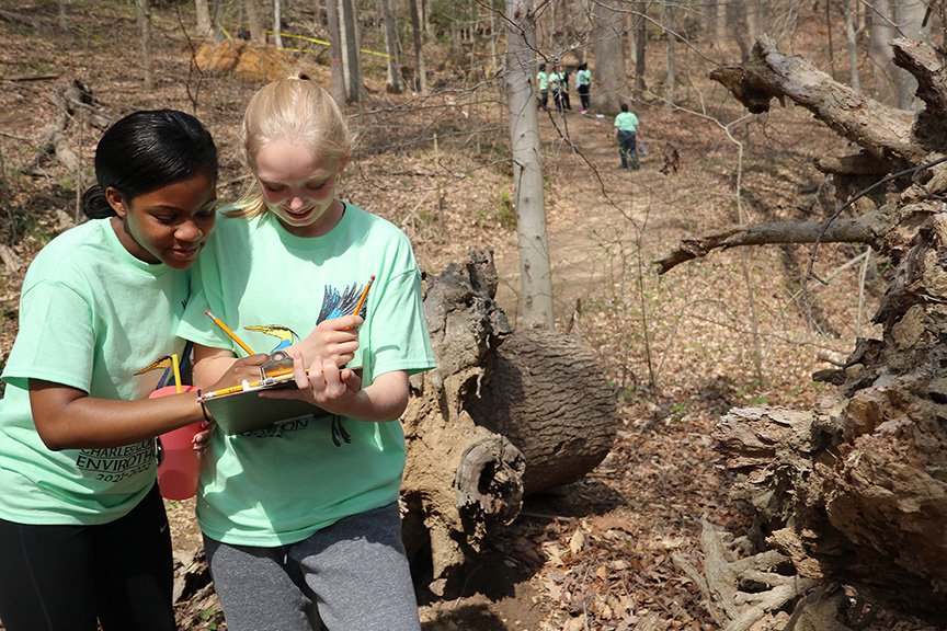 Henry E. Lackey High School seniors Tyne Kidd, left, and Charlie Klinger go over their notes during the Charles County Envirothon.