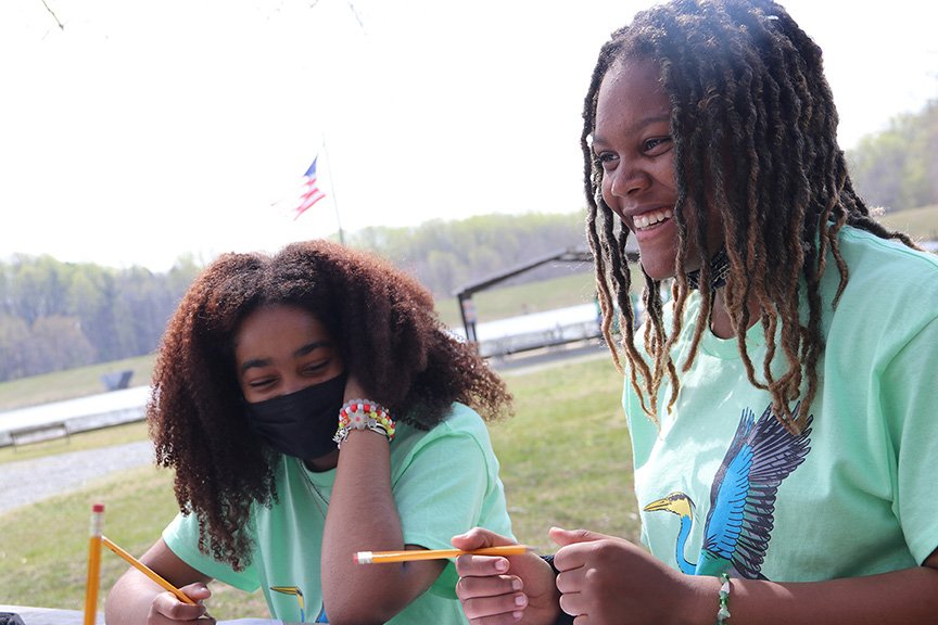 St. Charles High School freshmen London Ross, left, and Serenity Shuff complete the wildlife portion of the Charles County Envirothon.