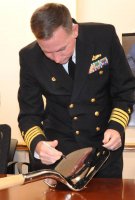 Naval Surface Warfare Center Dahlgren Division (NSWCDD) Commanding Officer Capt. Casey Plew signs a shovel prior to a groundbreaking ceremony for the new Cyber Warfare Engineering Laboratory. Plew broke ground with officials from NSWCDD, Naval Sea Systems Command, and CFM Engineering for the new facility that will provide a robust and flexible software and hardware testing capability for Department of Defense and Navy weapon systems, cyber and network platforms in addition to industrial control systems supporting DoD infrastructure. (Photo by U.S. Navy/Released)