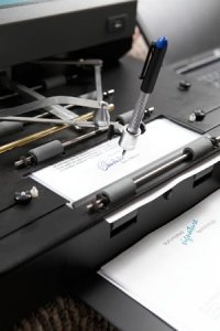 0713_autopen_signing.jpg