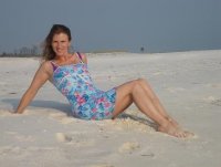 Jana sitting on beach.JPG