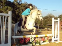 Avery Jumping flowers with Ariel.JPG