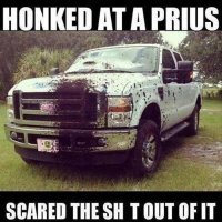 funny-pickup-is-covered-with-mud-by-a-prius.jpg