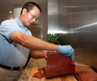 cnet-military-meat-xingchu-li-fpl-cutting-meat.jpg