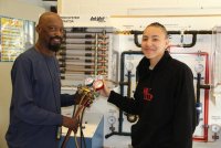 St. Charles High School junior Arica Jones, left, works with the HVAC instructor at the Robert D. Stethem Educational Center, John Young, to set up an activity for a class assignment. Jones is a first year student in the HVAC program at Stethem and said she chose a career and technology education (CTE) track toward her high school diploma because she likes to learn by doing. 