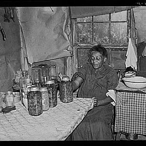 Mrs. Dyson with canned goods, Sept 1940