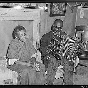 Mr. Dyson plays accordian for his wife, Sept 1940