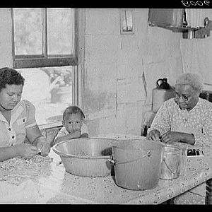 Shelling snap beans in the Biscoe kitchen