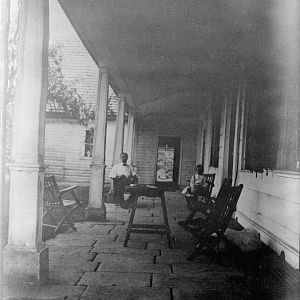 Looking south along front portico. (c. 1910)