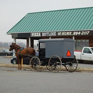 Something Amish. (note the sign above the buggy)
