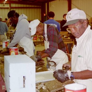 Professional shuckers preparing oysters for sale to the public