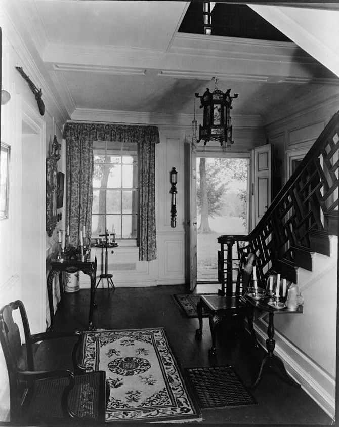 Entrance hall and stairs, looking east