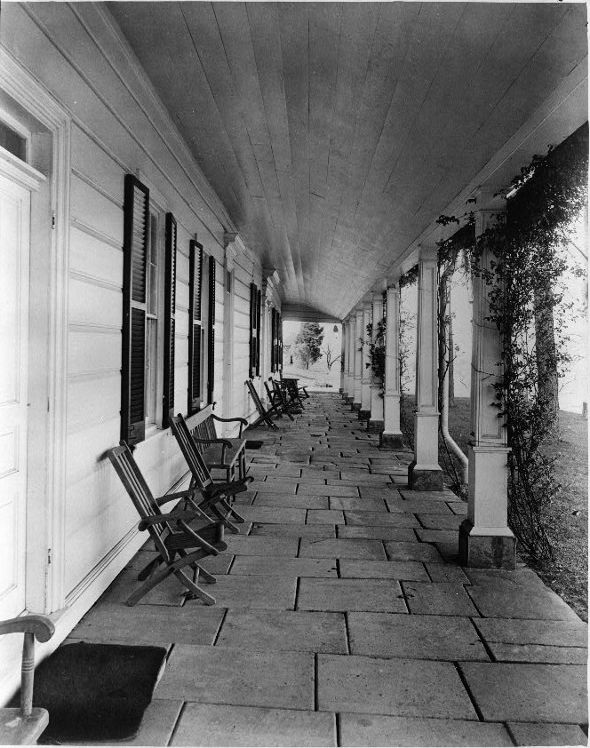 Flagstone portico, at extreme left, door to dining room