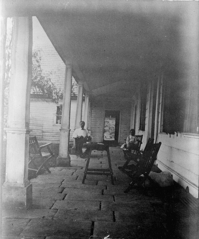Looking south along front portico. (c. 1910)