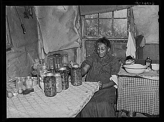 Mrs. Dyson with canned goods, Sept 1940