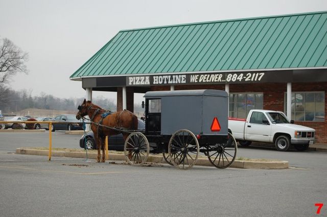 Something Amish. (note the sign above the buggy)