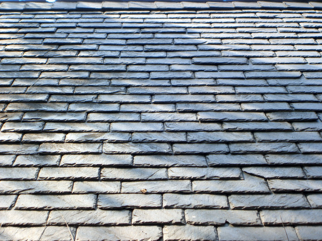 The real slate roof on the red brick church